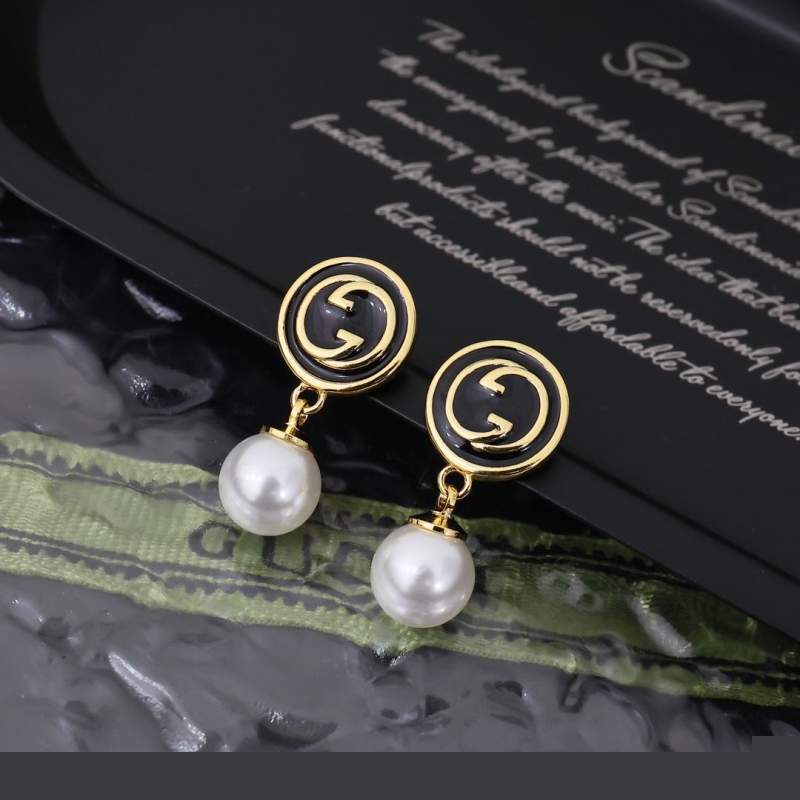 G*u*i earrings